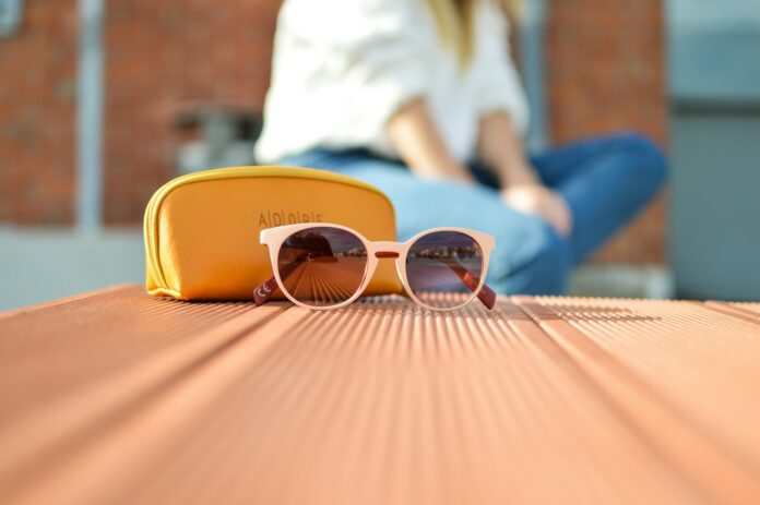 Photo by Tamara Bellis sunglasses beside a purse