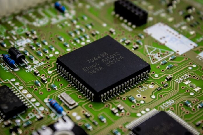 a close up of a computer chip on a printed circuit board