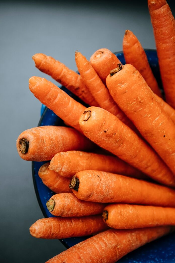 Photo by Markus Spiske orange carrots on blue round plate