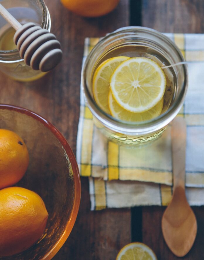 Photo by Anda Ambrosini clear glass container with lemon slices