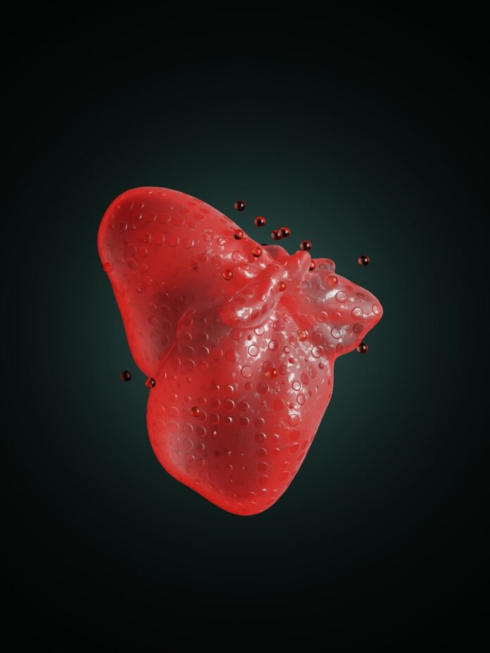 Photo by TSD Studio a red substance floating on top of a black surface