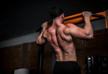 “근육 관리, 현대인의 건강 미션…일상 속 작지만 확실한 실천법” topless man in black shorts holding orange bar
